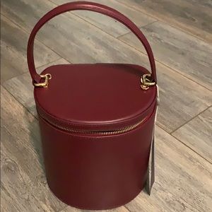 NWT Staud bucket bag in burgundy.